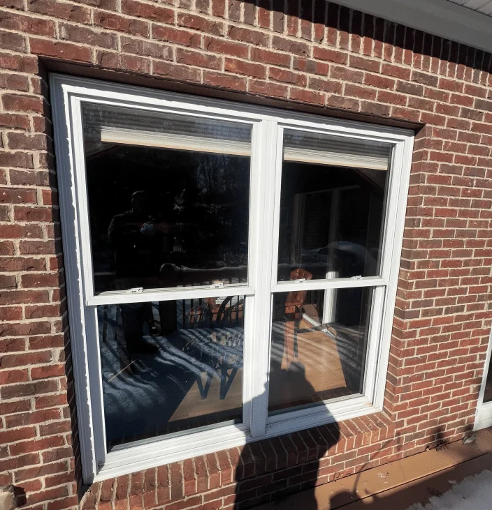 Before: the old grid windows on the same home, being replaced
